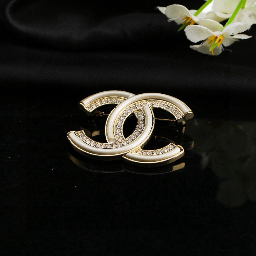 Double-C Emblem Brooch in Polished Metal-Tone – Design 021 close-up detail