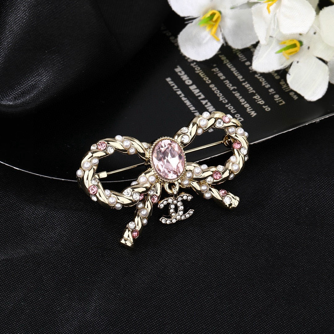 Double-C Emblem Brooch in Polished Metal-Tone – Pink Detail detail view