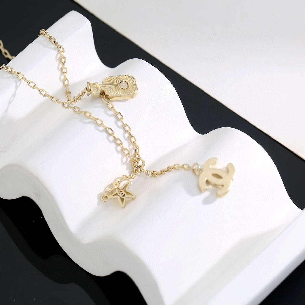 Double-C Emblem Pendant Necklace in Polished Metal-Tone – Design 009 front product view
