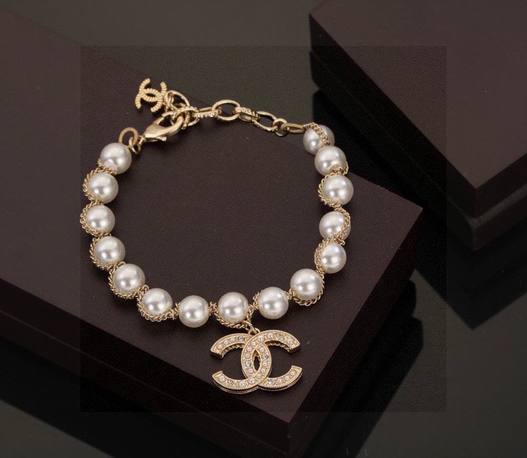 Double-C Emblem Bracelet in Polished Metal-Tone – Pearl Detail – Design 002 front product view