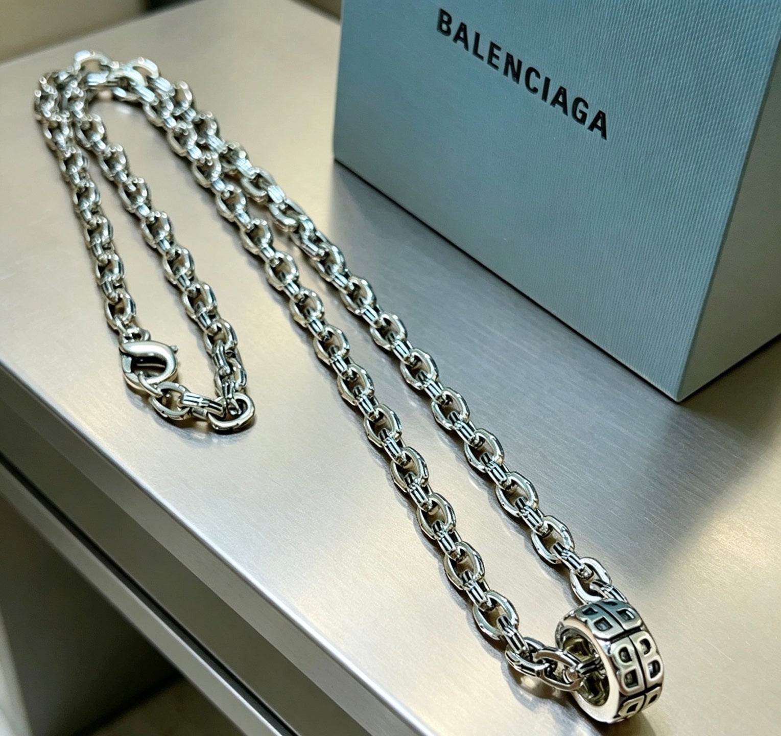 Geometric Emblem Pendant Necklace in Polished Metal-Tone – Vintage Detail front product view
